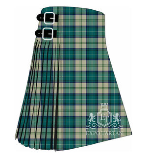 Men's Elsa Tartan Kilt showing traditional knife pleats and black leather side straps in a rich teal-green, warm stone-beige, and deep navy blue sett, intricately intersected by crisp white and forest green overcheck