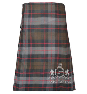 Men's Guthrie Weathered Tartan Kilt showing traditional knife pleats and black leather side straps in a rustic slate grey and brown sett, intricately intersected by dark charcoal bands and striking red overchecks