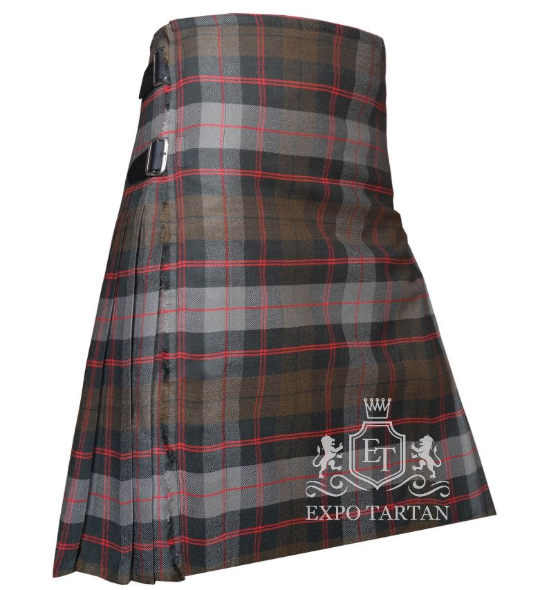 Men's Guthrie Weathered Tartan Kilt showing traditional knife pleats and black leather side straps in a rustic slate grey and brown sett, intricately intersected by dark charcoal bands and striking red overchecks
