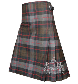 Men's Guthrie Weathered Tartan Kilt showing traditional knife pleats and black leather side straps in a rustic slate grey and brown sett, intricately intersected by dark charcoal bands and striking red overchecks